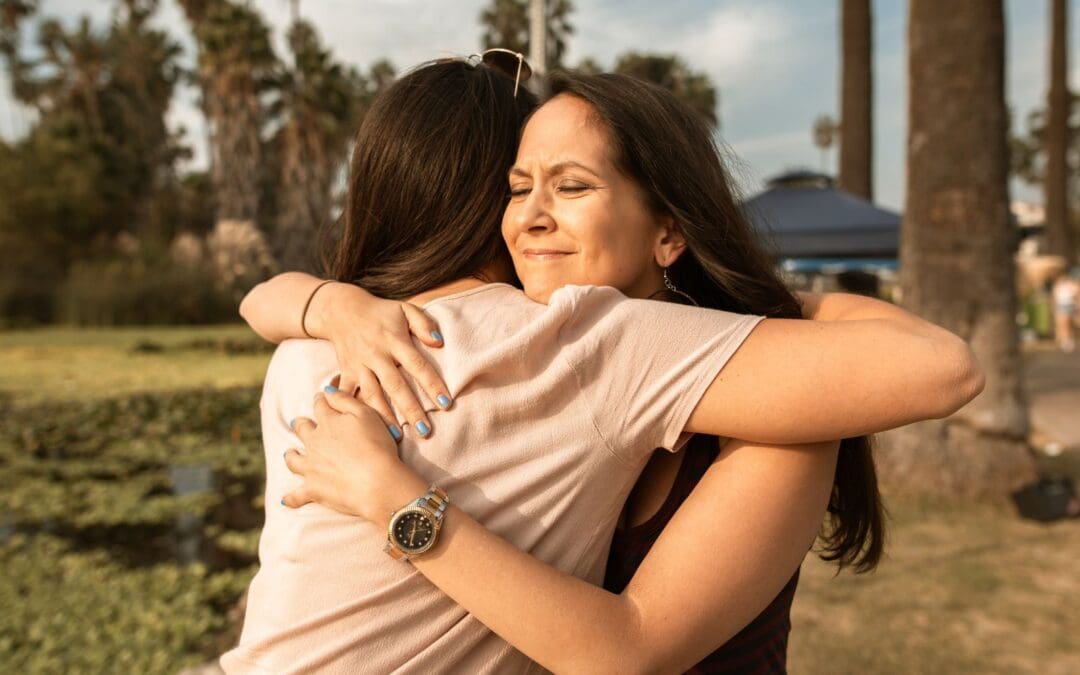 woman hugging a friend after abortion